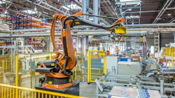 An industrial robot working in a production facility An industrial robot working in a production facility