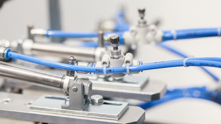 Close up view of a pneumatic valve and piston