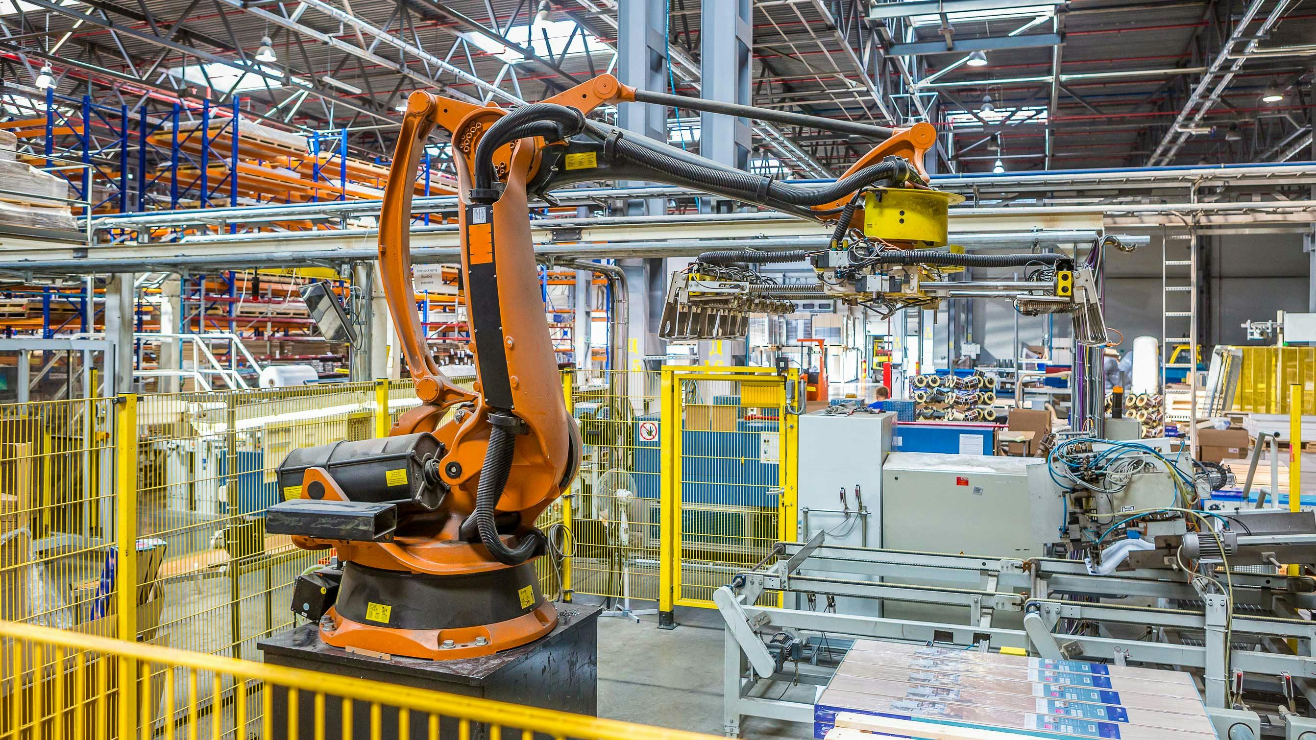 An industrial robot working in a production facility