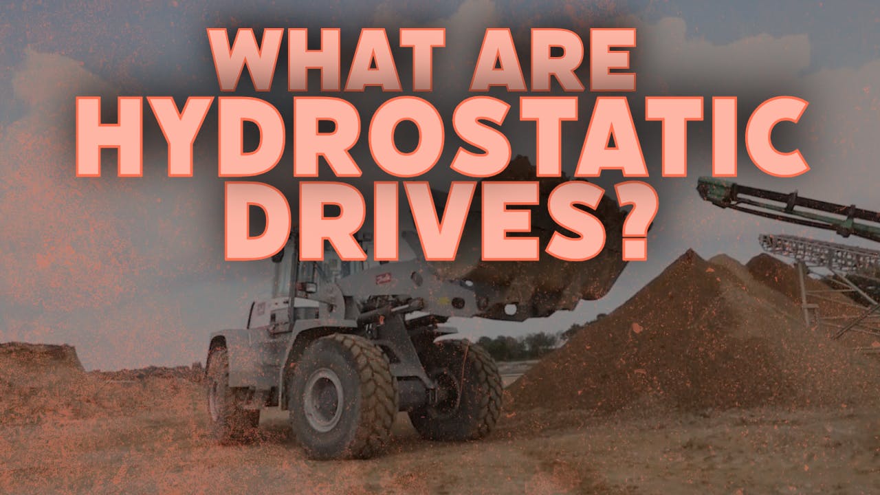 A wheel loader working in the dirt which is equipped with a hydrostatic transmission