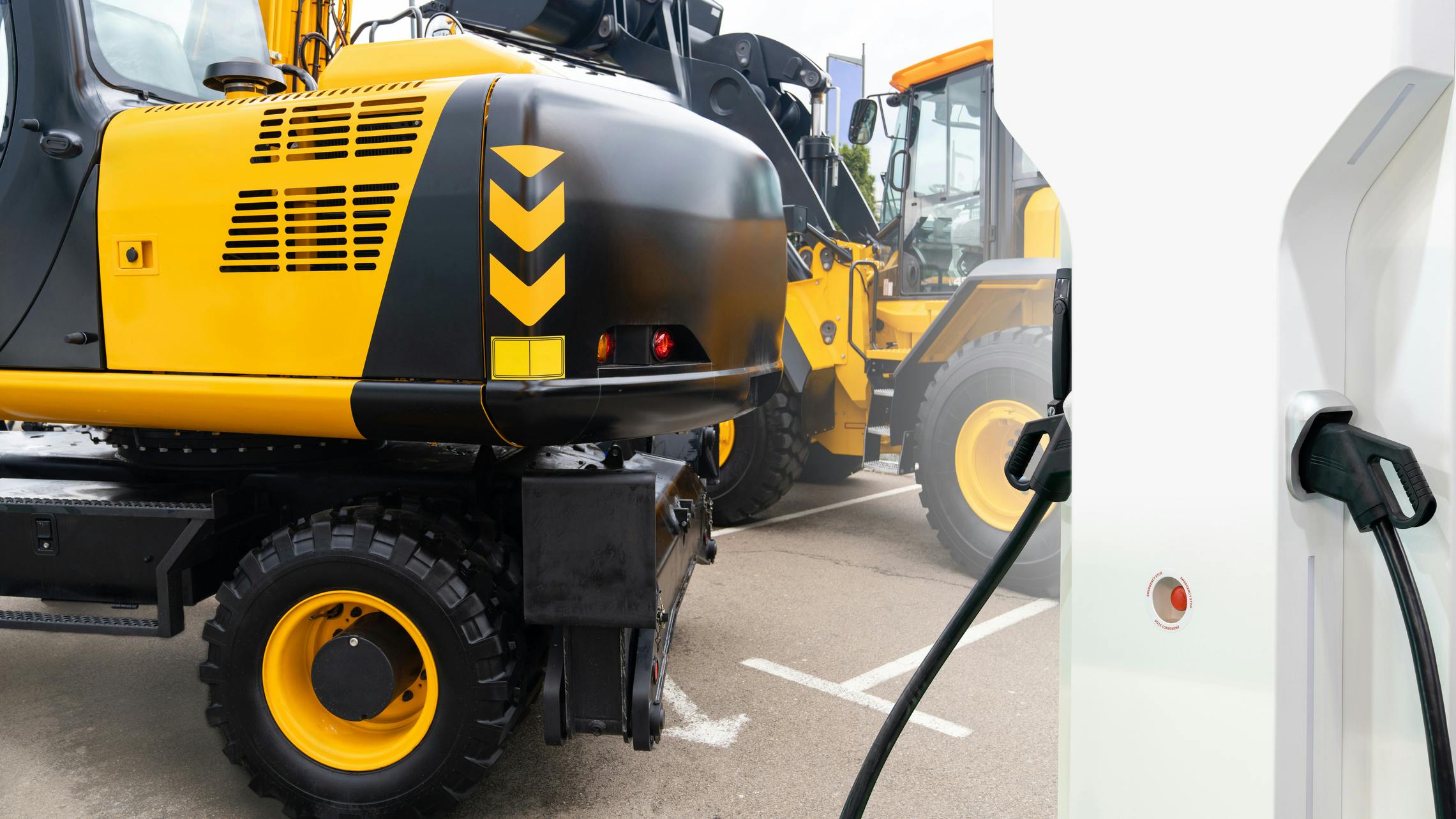 Concept image of a charger and electric construction machine