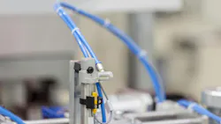 Close up on pneumatic components installed on industrial machinery Close up on pneumatic components installed on industrial machinery