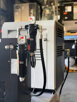 Close up view on dryer and filter for a compressed air system Close up view on dryer and filter for a compressed air system