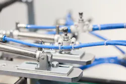 Close up of pneumatic valves and pistons Close up of pneumatic valves and pistons