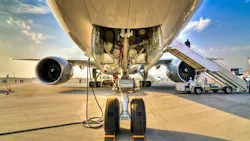 View of underside of an airplane an its landing gear View of underside of an airplane an its landing gear