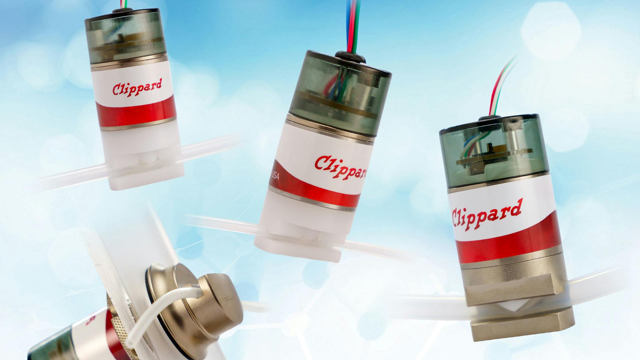 Multiple Clippard State Feedback Pinch Valve on a blue and white background