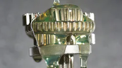 Lubricant Being Poured onto a Gear Lubricant Being Poured onto a Gear