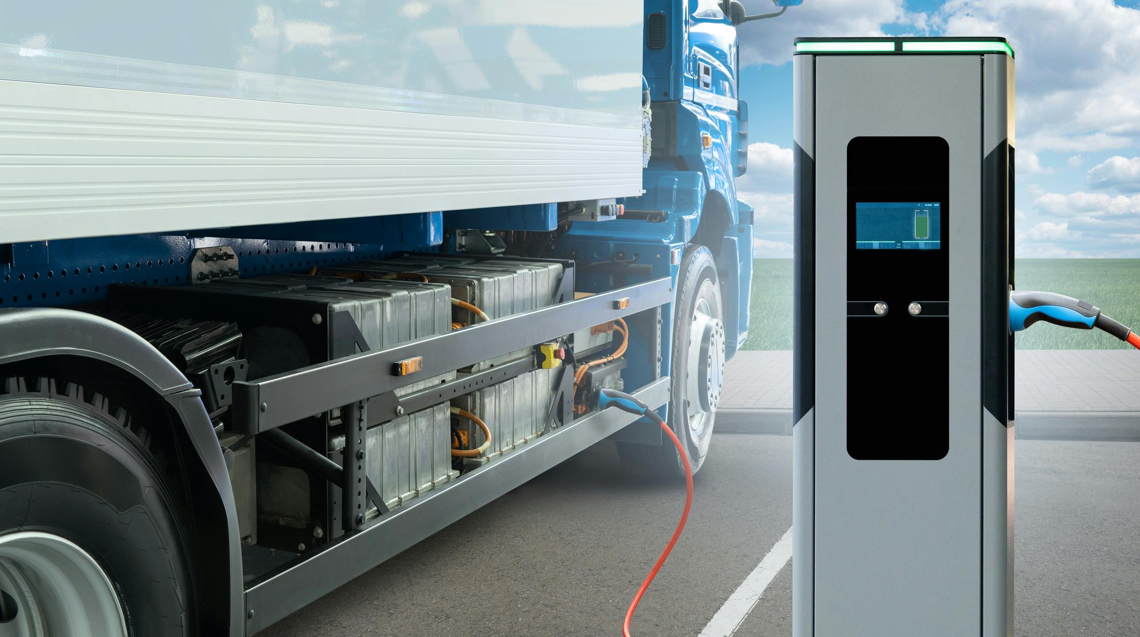 Concept of Heavy-Duty Electric Truck Next to Charger