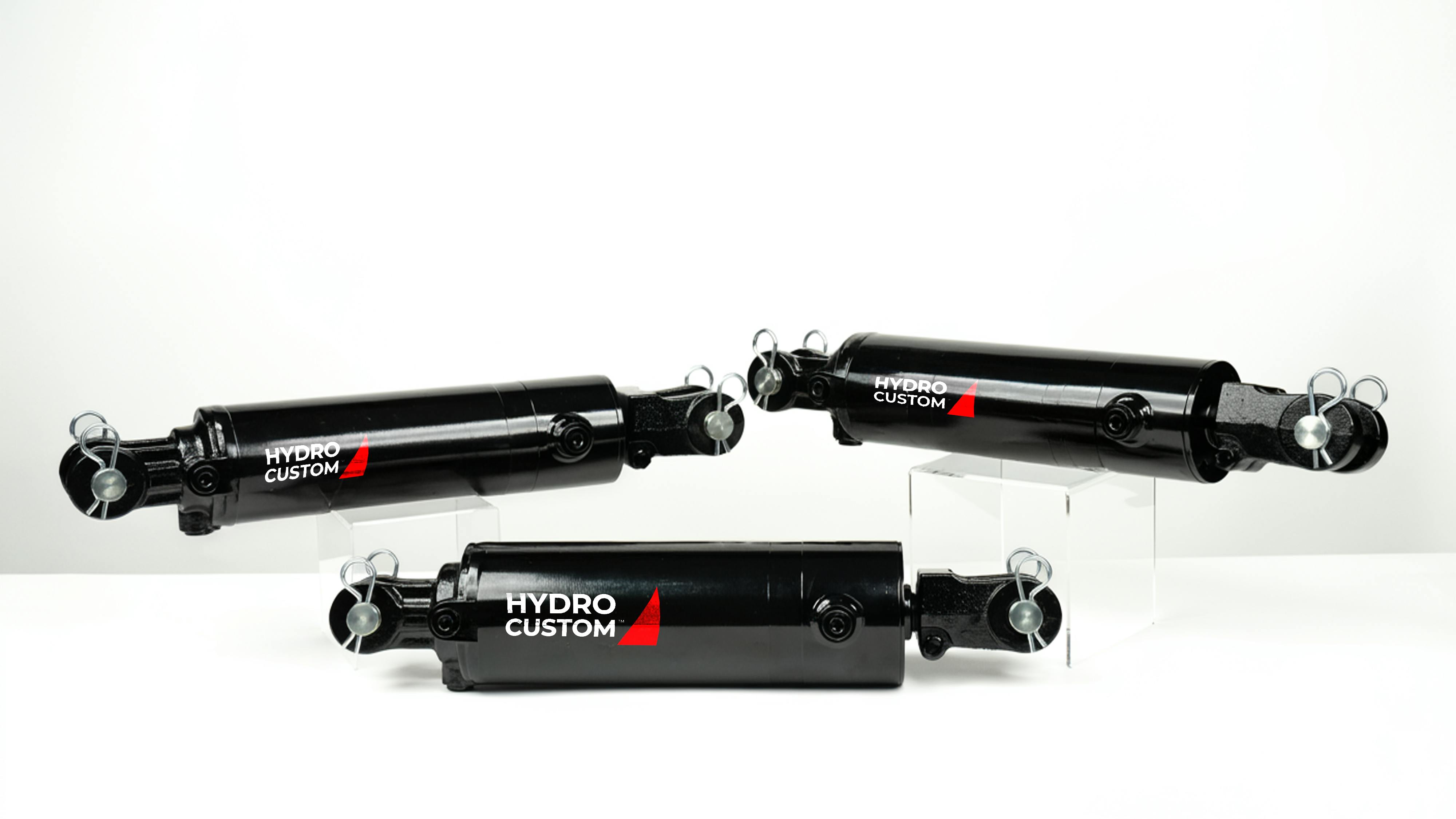 Three Bailey Hydro Custom WC Series Cylinders on a white background