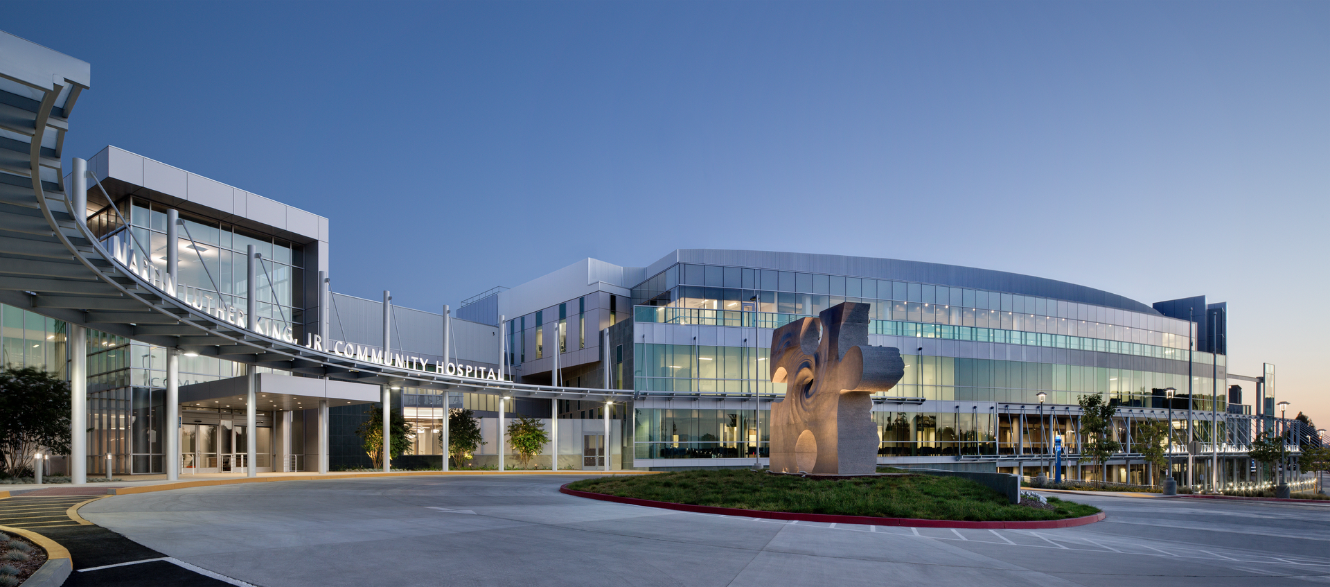 A puzzle piece sculpture sits in the center of the entry port, a symbol of how important the facility is to the fabric of its neighborhood and lips set in behind it represent the voices of those that kept it alive.