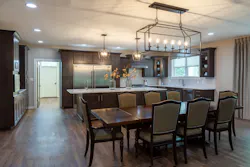 Shared meals are provided in the dining space as part of the open kitchen. Shared meals are provided in the dining space as part of the open kitchen.