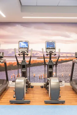 The fitness center features a floor to ceiling image of Mission Bay. The fitness center features a floor to ceiling image of Mission Bay.