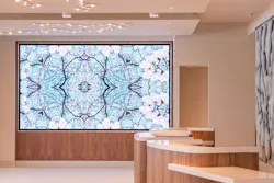 Check in features a variety of art installations that play off the strong blue theme/palette running throughout the property, including dimensional mural of the site’s wetlands (right) and a rotating digital art commission (left). Check in features a variety of art installations that play off the strong blue theme/palette running throughout the property, including dimensional mural of the site’s wetlands (right) and a rotating digital art commission (left).