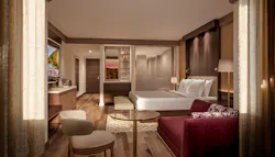 To improve TV access, the traditional room credenza can be moved to the closet or in proximity to an open bathroom concept, creating an integrated dressing area with a convenient luggage bench. To improve TV access, the traditional room credenza can be moved to the closet or in proximity to an open bathroom concept, creating an integrated dressing area with a convenient luggage bench.