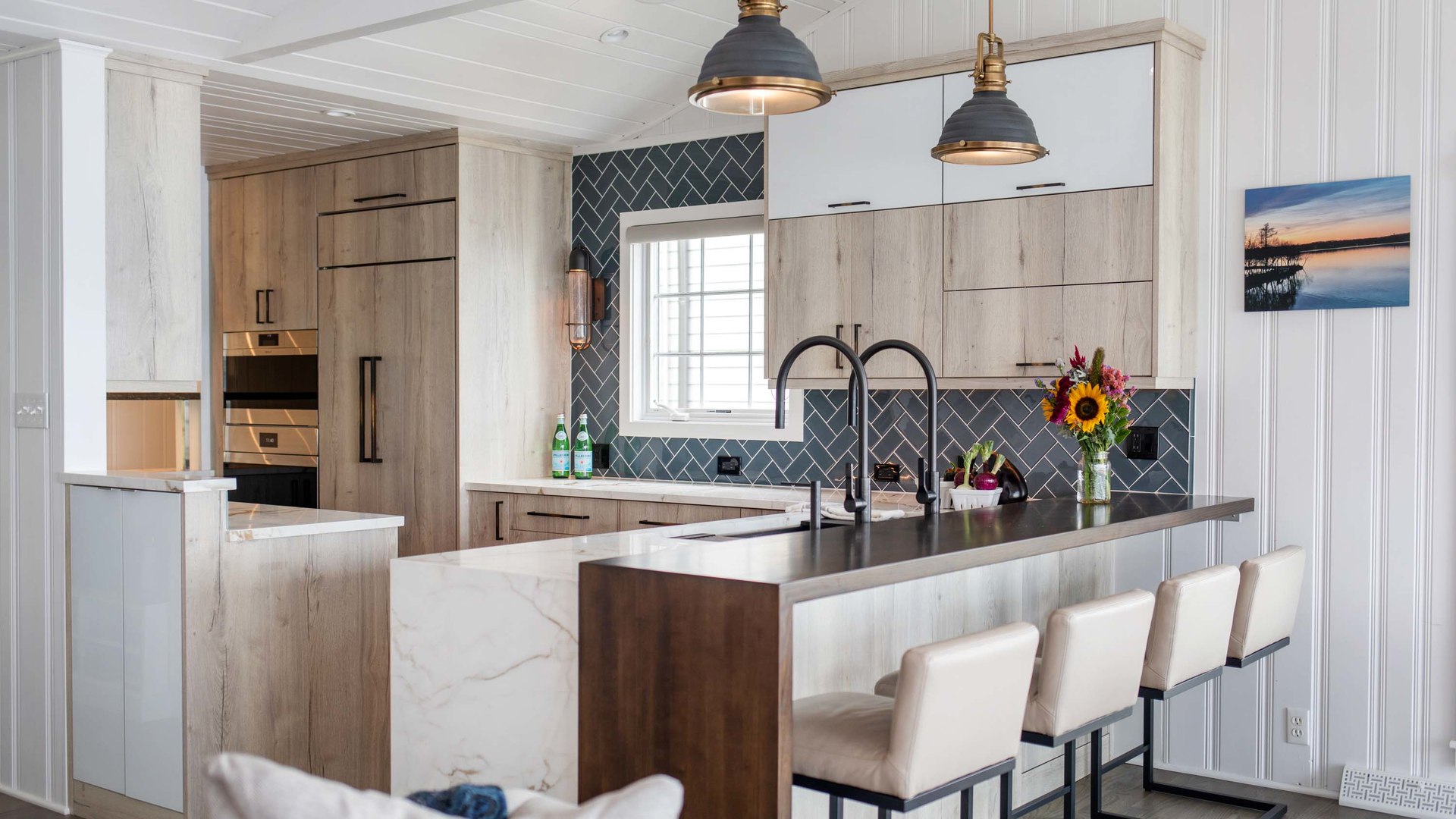 Designer Joyce Zuelke, CKBD of Geneva Cabinets, designed a flat grain wood pastore waterfall countertop for a seamless flow.