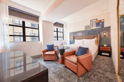 The Dagny Boston King Deluxe room offers a playful sense of sophistication and craftsmanship with leather-like fabrics on the furniture set off by a blue accent headboard. The Dagny Boston King Deluxe room offers a playful sense of sophistication and craftsmanship with leather-like fabrics on the furniture set off by a blue accent headboard.