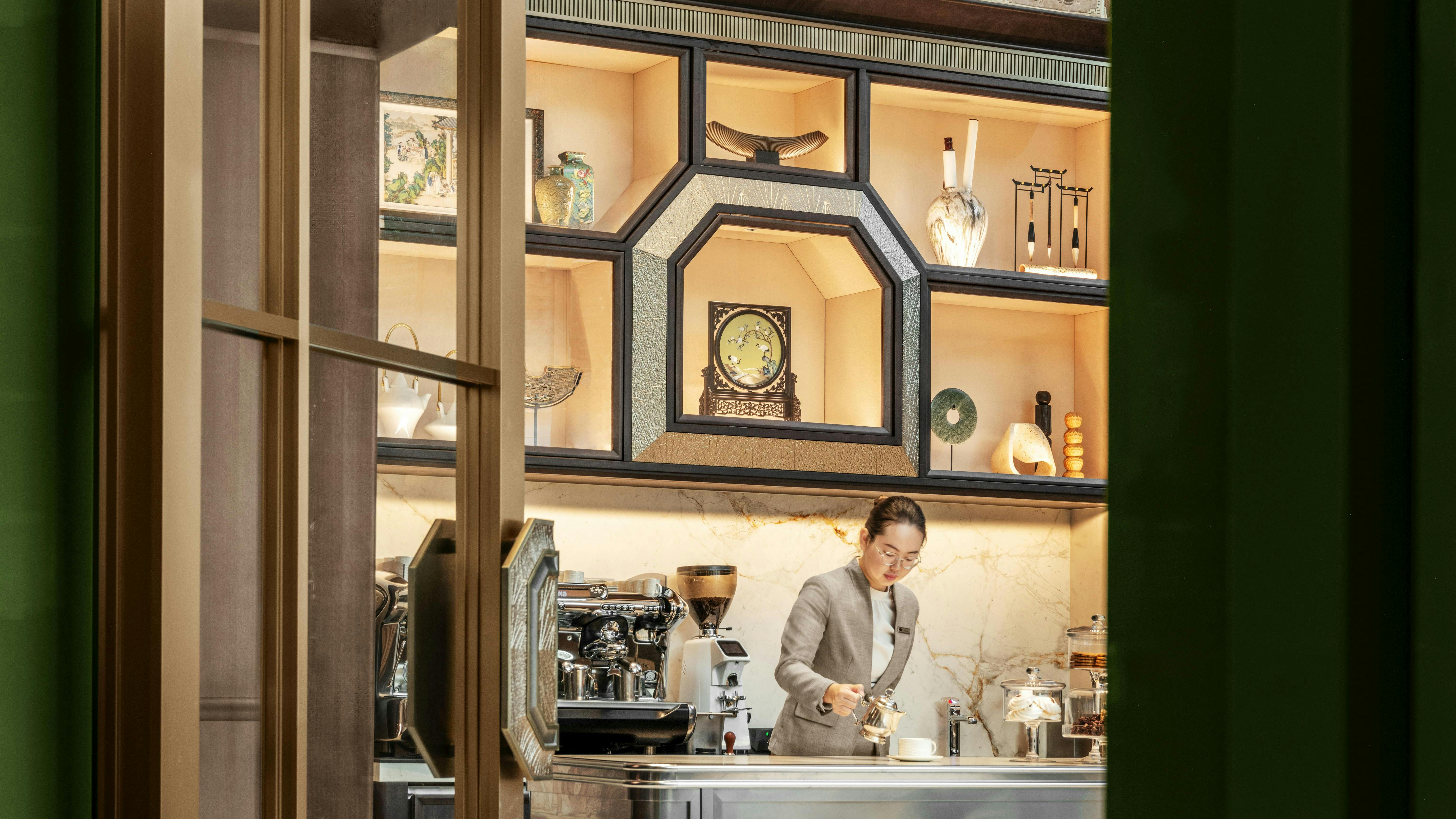 The custom bar counter and shelving backdrop can serve host to private events such as baking and floral design classes.