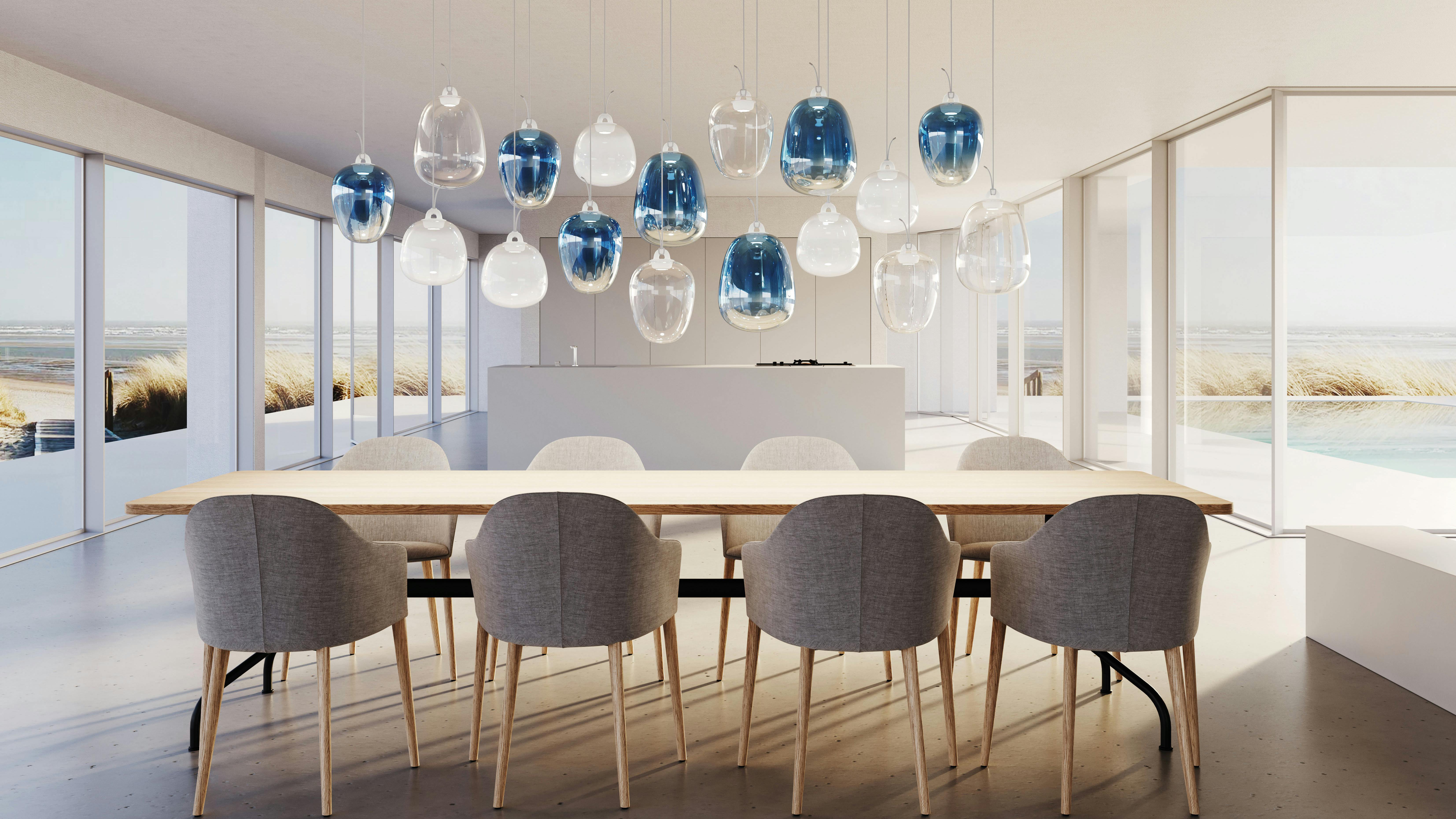 Lodes' Oblo lighting cluster installed over a table.