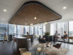This daylit break room lends a modern coffee bar vibe and references the organization’s brand through lines and circles in the ceiling plan. This daylit break room lends a modern coffee bar vibe and references the organization’s brand through lines and circles in the ceiling plan.