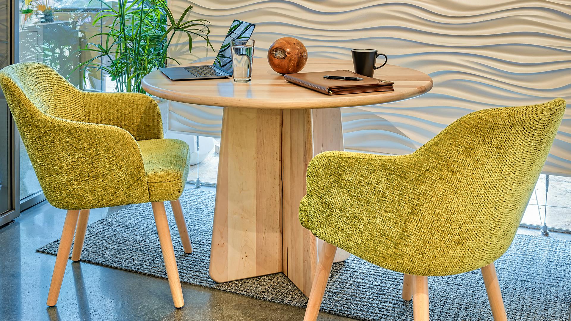 The Unity Table Collection features a flat-pack design.