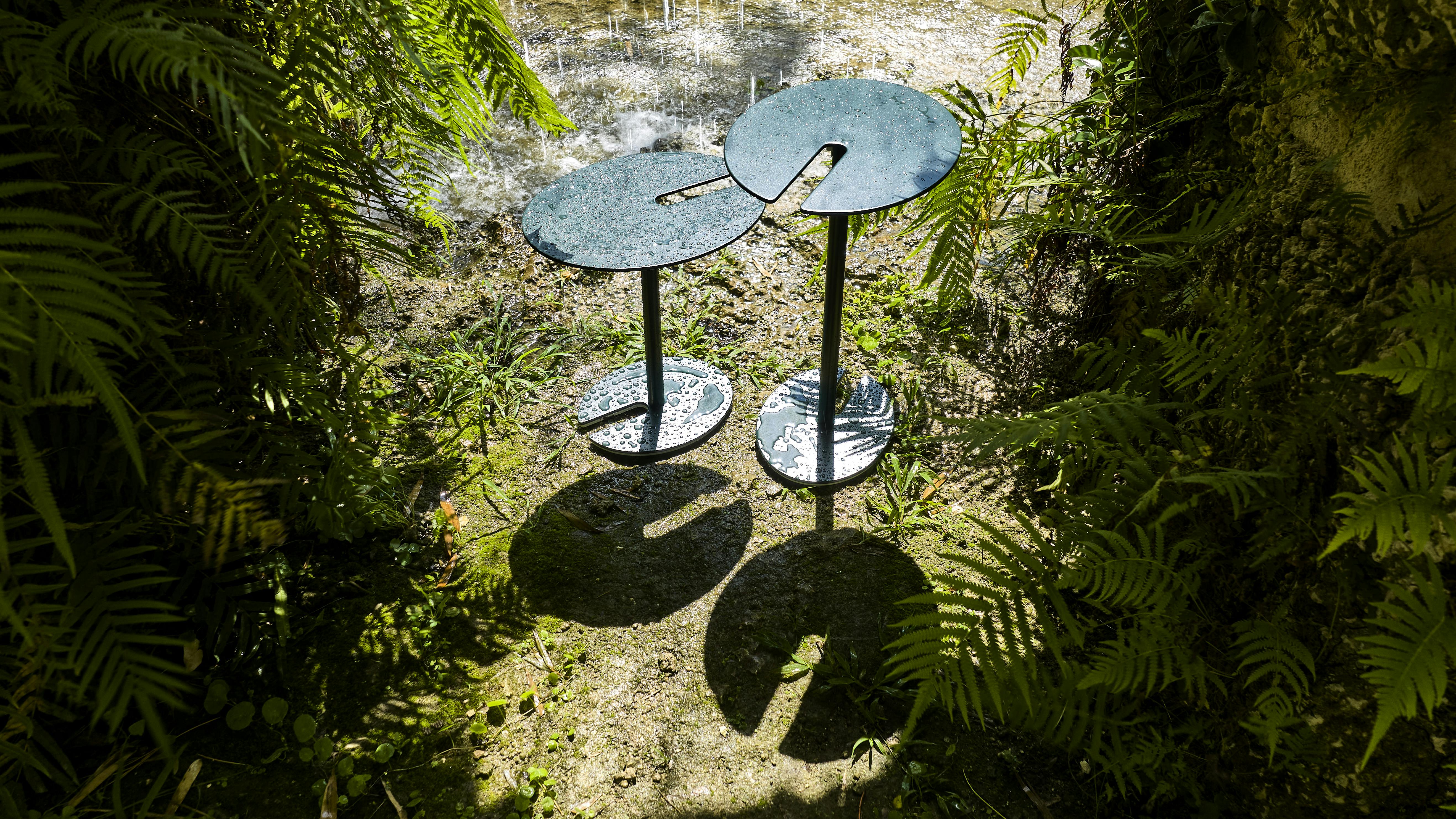 Pavilion's Lirio Table set up in a nature scene.