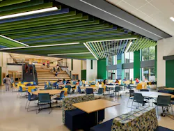Stantec, which handled architecture design, created an interior template across four of the schools. These two cafeterias demonstrate how the spaces were given an individual look through color choices. Stantec, which handled architecture design, created an interior template across four of the schools. These two cafeterias demonstrate how the spaces were given an individual look through color choices.