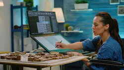 Interior designer drafting a concept layout Interior designer drafting a concept layout