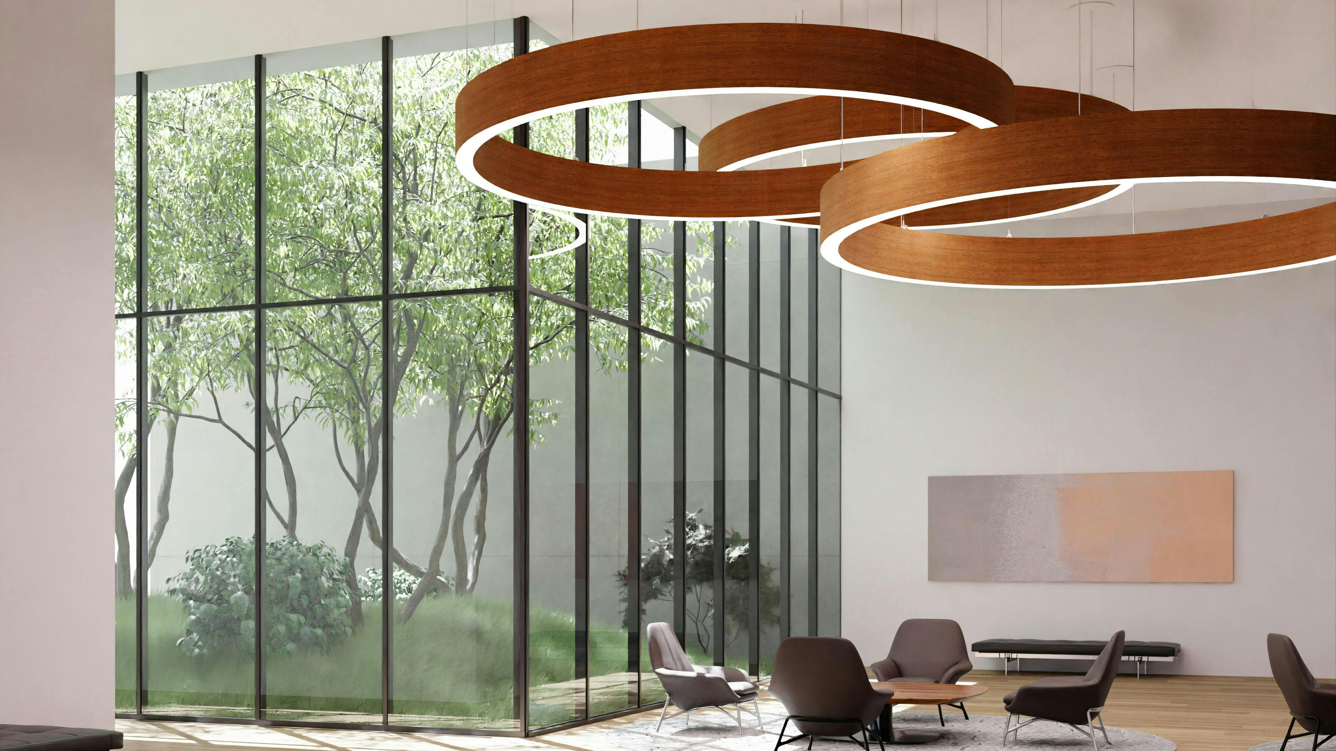 Circular LightArt Acoustic Collection wood texture lighting fixture shown in Carmel Oak.