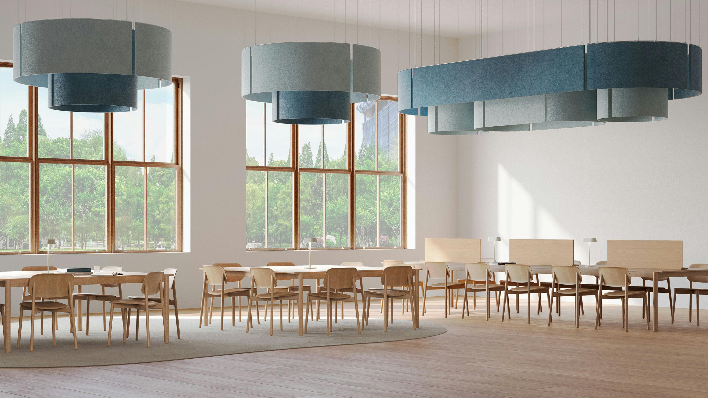 The Nest Baffle suspended over tables and chairs.