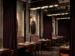 References to the building's manufacturing legacy garnish the dining areas: leather accents, butcher block wood, and functioning gas lanterns. References to the building's manufacturing legacy garnish the dining areas: leather accents, butcher block wood, and functioning gas lanterns.