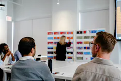 Perkins&Will employees brainstorm show for ART on THE MART in an office. Perkins&Will employees brainstorm show for ART on THE MART in an office.