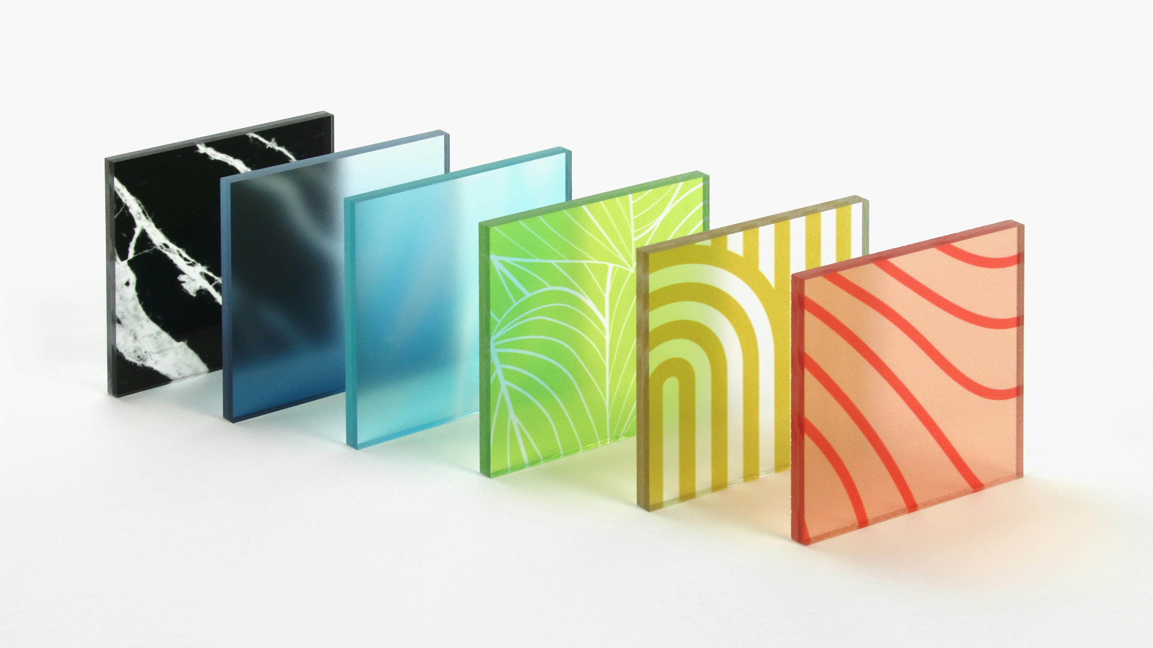 Variety of square acrylic samples with various colors and patterns.