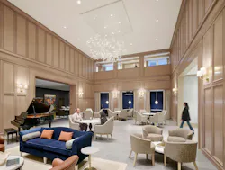 Inspir Embassy Row DC gathering room with light wood millwork, vintage-look chandelier, grand piano, and accents of navy and orange amid neutral tones Inspir Embassy Row DC gathering room with light wood millwork, vintage-look chandelier, grand piano, and accents of navy and orange amid neutral tones