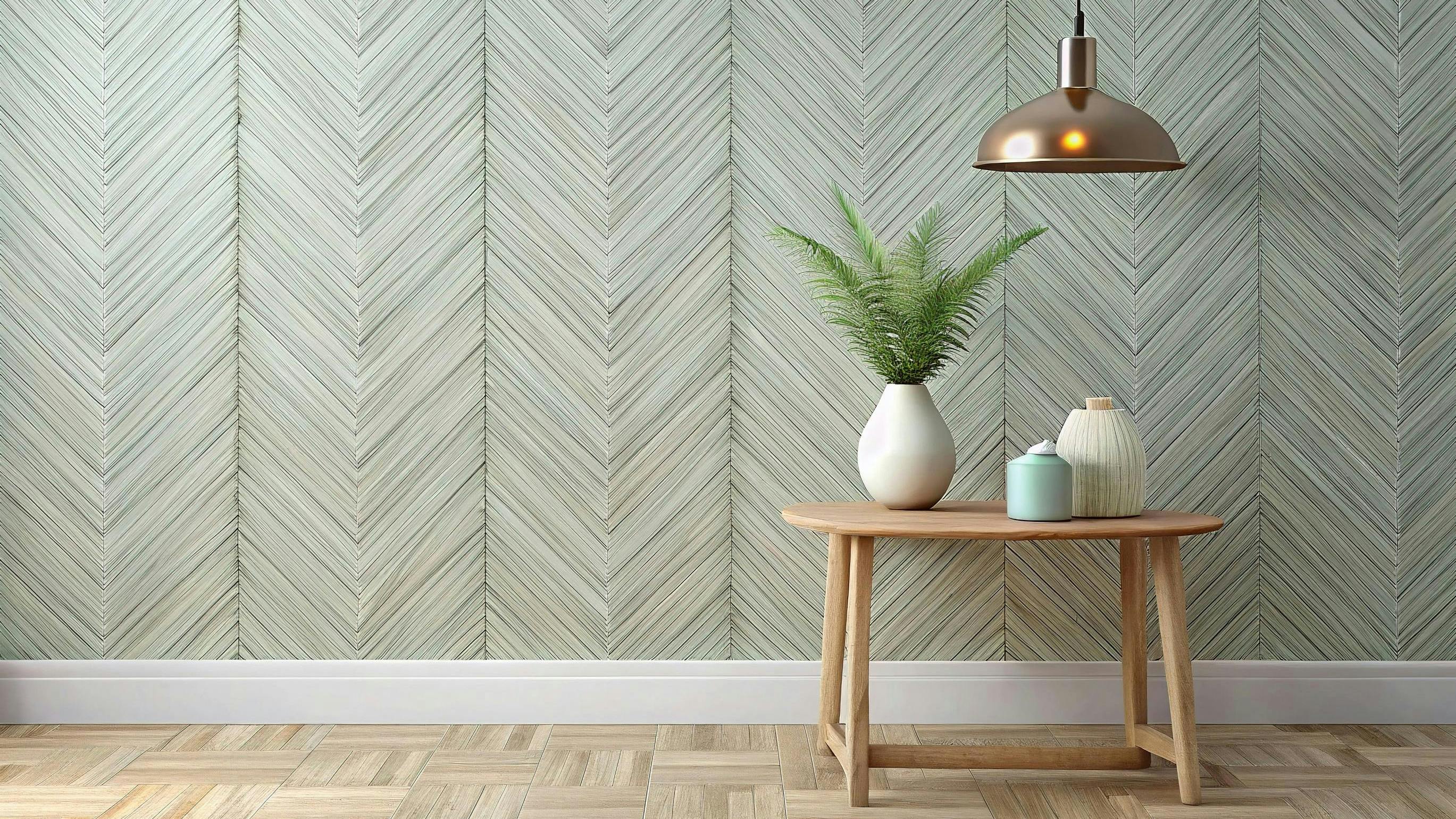 Herringbone pattern wallcovering in pale green with the look of woven fibers