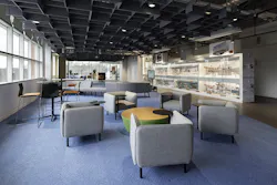 Large-scale office interior adjacent to manufacturing space, featuring connective elements of color, shape, and sightline. Large-scale office interior adjacent to manufacturing space, featuring connective elements of color, shape, and sightline.