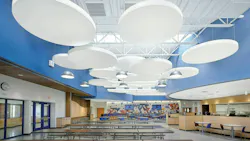Acoustibuilt Seamless Acoustical Ceiling Clouds in white distinguish large-group seating areas against a sky-blue wall surround in the cafeteria at Saratoga Springs High School. Acoustibuilt Seamless Acoustical Ceiling Clouds in white distinguish large-group seating areas against a sky-blue wall surround in the cafeteria at Saratoga Springs High School.