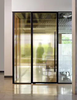 An enclosed conference room with patterned glass panels offers a balance of transparency and privacy to office collaboration. An enclosed conference room with patterned glass panels offers a balance of transparency and privacy to office collaboration.