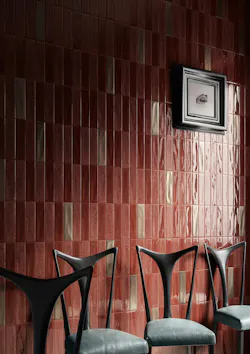 The Porto Rotondo ceramics are installed on a wall in shades of pink and white. The Porto Rotondo ceramics are installed on a wall in shades of pink and white.