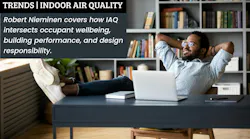 Black male employee enjoys a window view from comfortable office Black male employee enjoys a window view from comfortable office