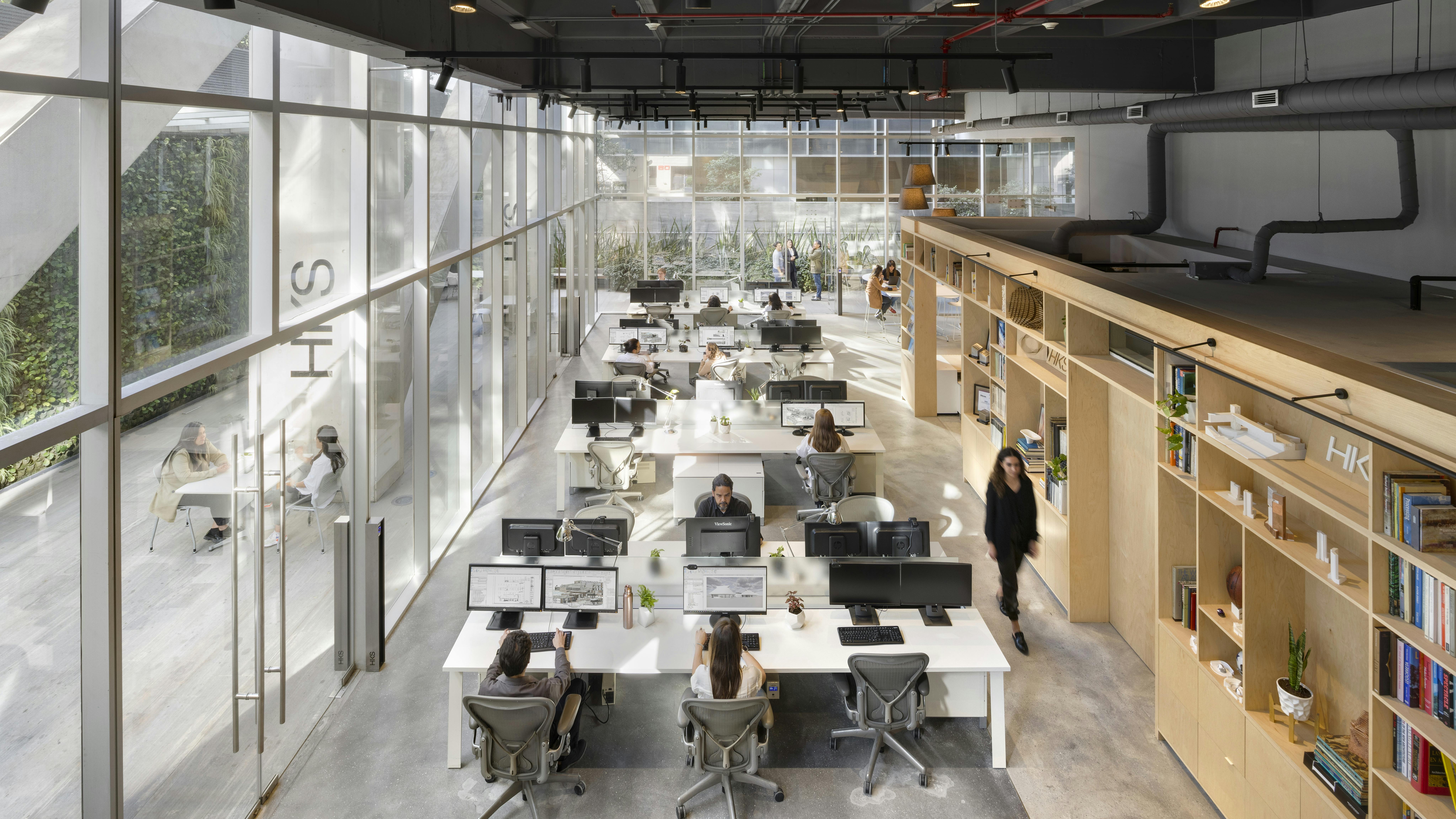 An aerial view of the HKS office in Mexico City, featuring various workstations.