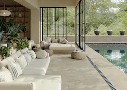 Neutral stone look tiled outdoor patio and pool area Neutral stone look tiled outdoor patio and pool area