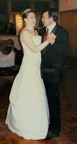 Young woman in wedding dress dancing with her father during wedding Young woman in wedding dress dancing with her father during wedding