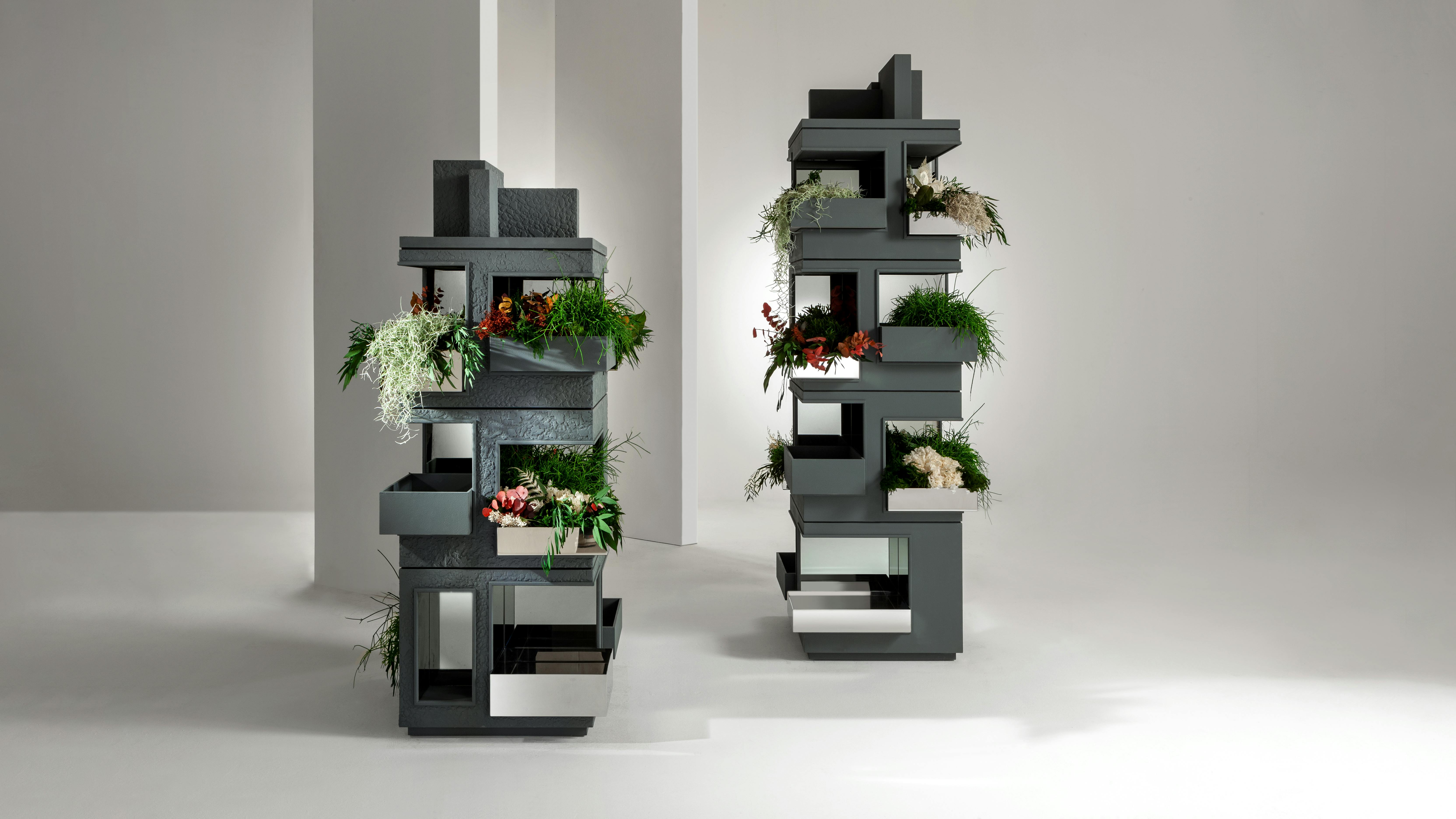 Vertical Garden is shown housing various plants, but the towers are multifunctional.
