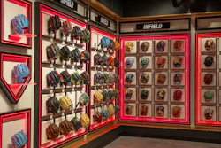 A colorful array of Rawlings gloves on red-illuminated displays inspired by baseball diamonds. A colorful array of Rawlings gloves on red-illuminated displays inspired by baseball diamonds.