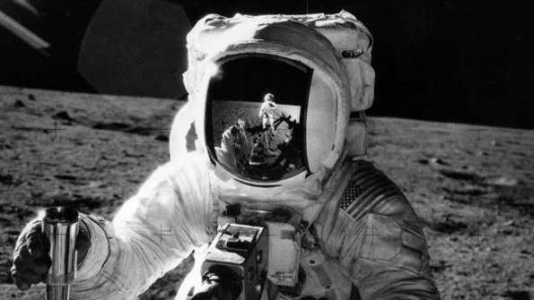 NASA astronaut Alan Bean holds a container of lunar soil during Apollo 12