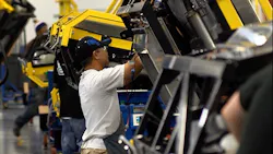 Carrier Transicold operator installing component on the trailer line where units can be rotated 360 degrees for optimum ergonomic positioning for the operator Carrier Transicold operator installing component on the trailer line where units can be rotated 360 degrees for optimum ergonomic positioning for the operator