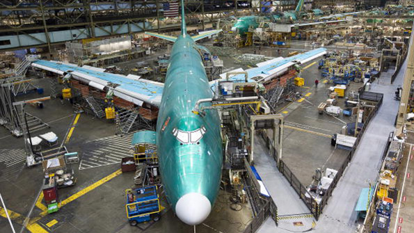 Boeing workers build a 747 at Paine Field in Everett Washington