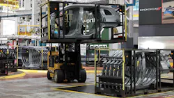 A forklift driver moves the racks of Jeep Cherokee body side panels at the FCA Sterling Stamping Plant A forklift driver moves the racks of Jeep Cherokee body side panels at the FCA Sterling Stamping Plant