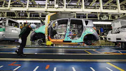 A Toyota worker inspects a car at the companys Takaoka plant A Toyota worker inspects a car at the companys Takaoka plant