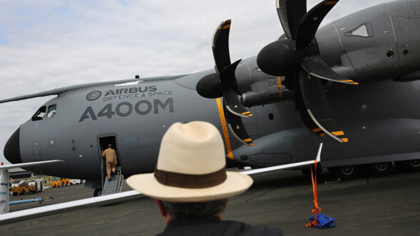 A spectator observes the new Airbus A400M military transport plane